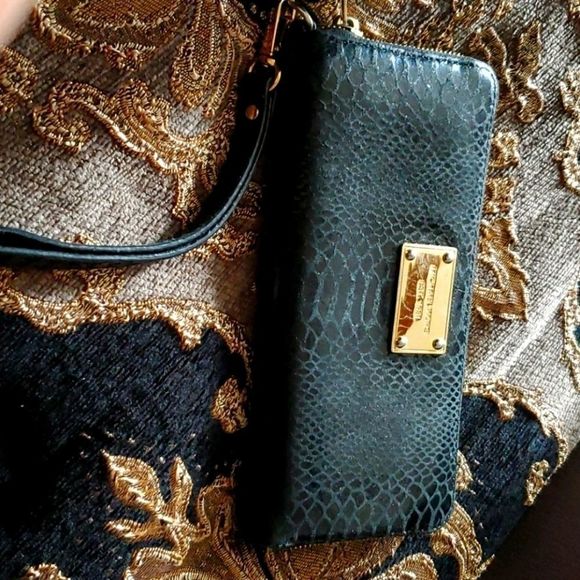 Michael Kors Handbags - Mk Michael Kors black snake print wallet guc